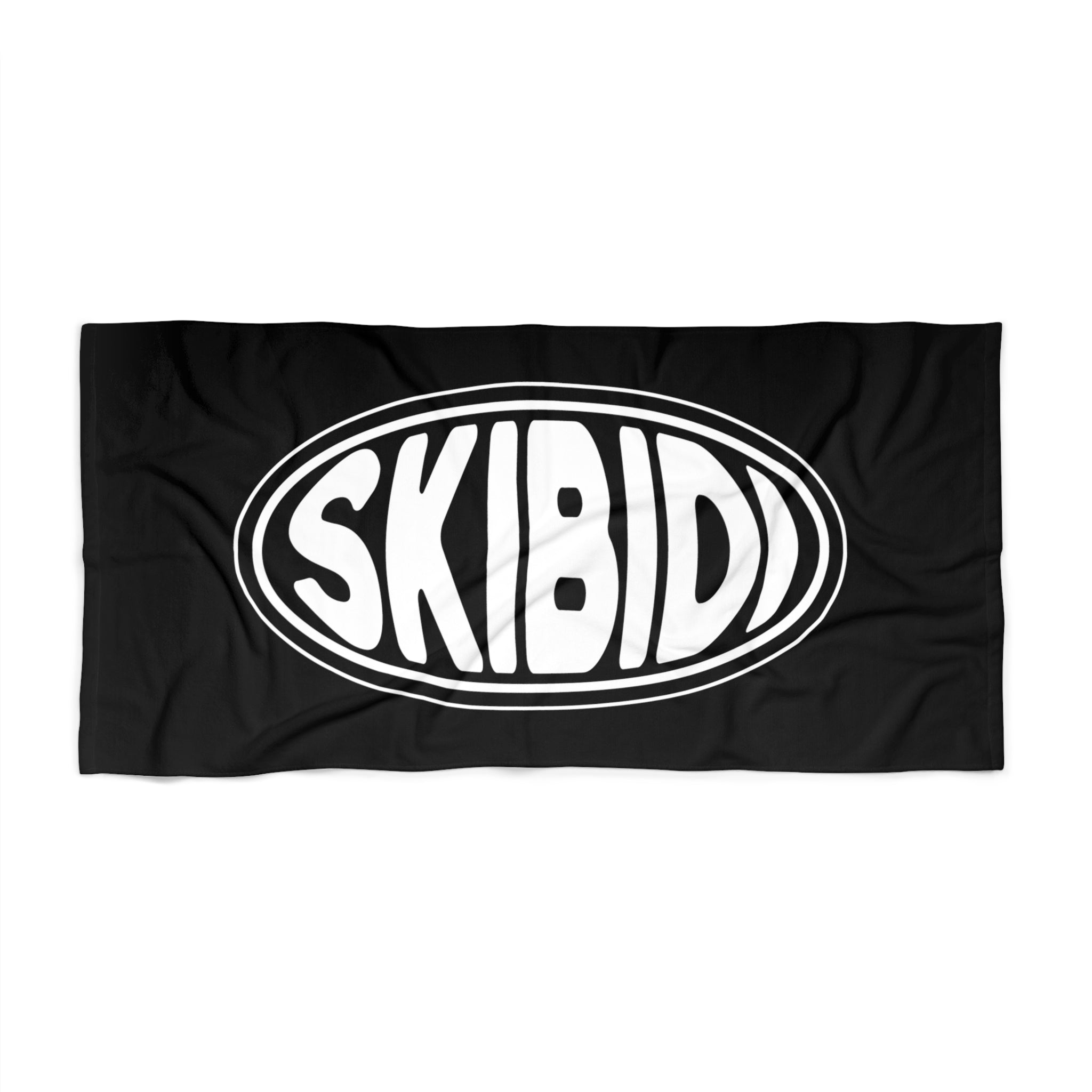 Beach towel in black and white featuring the SKIBIDI oval emblem