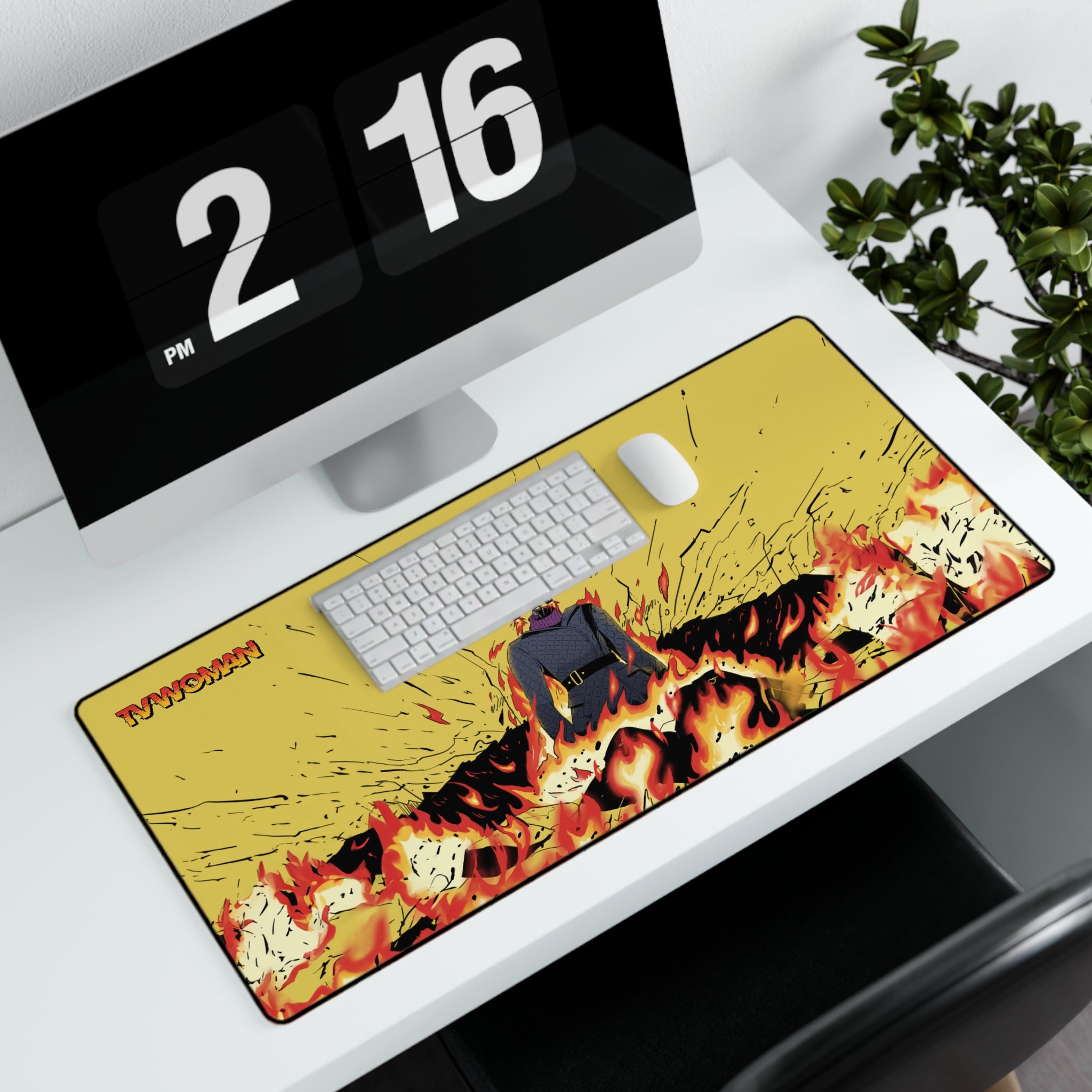 Wide gaming mouse pad featuring comic-style TV Woman illustration. on white desk with computer mouse keyboard